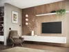 A modern living room with a TV mounted on a wood-paneled wall, a white media console, and a comfortable armchair. Anteprima dell’immagine prodotto