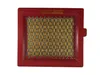 A red air filter with a yellow mesh filter element, set against a white background. Anteprima dell’immagine prodotto