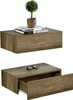 Two identical wooden shelves are shown against a white background. The top shelf has books and a small potted plant. The bottom shelf has a drawer partially open and a pair of sunglasses on top. Náhled obrázku produktu
