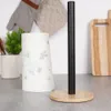 A kitchen counter with a paper towel holder and a roll of paper towels. Náhled obrázku produktu