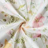 A close-up of a fabric with a floral pattern. Produktbild-Vorschau