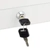 A close-up shot of a lock on a white surface with two keys inserted. Produktbild-Vorschau