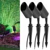 Three black garden spotlights with stakes and wires are shown against a white background, with a separate image of a garden illuminated by colored lights. Náhľad obrázku produktu