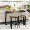 A bar table and two stools are set up in a living room, positioned behind a sofa. The table is adorned with decorative items, including a vase of greenery, salt and pepper shakers, and bottles of drinks with glasses. Anteprima dell’immagine prodotto