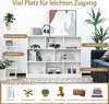A white bookshelf filled with various items, presented in a room setting with plants and a sofa. Voir les images du produit