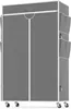 A gray fabric wardrobe with a white frame on wheels. Voir les images du produit