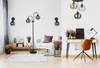 A modern living room and home office setup with various lighting fixtures and furniture. Produktbild-Vorschau