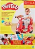 The image shows the packaging of a Play-Doh Pizza Delivery Scooter Playset, featuring a child playing with the toy. Produktbild-Vorschau