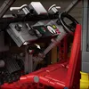 Close-up view of the interior of a toy car model, focusing on the dashboard and driver's seat. Náhľad obrázku produktu