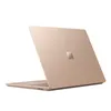 A top-down, angled view of a closed gold-colored laptop with the Microsoft logo on the lid, set against a white background. Produktbild-Vorschau