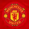 The image shows the Manchester United FC logo on a red background. Produktbild-Vorschau