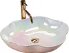 A close-up studio shot of a decorative vessel sink with a faucet. Náhľad obrázku produktu
