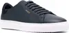 A close-up, side view of a single dark blue sneaker with a white sole. Produktbild-Vorschau