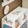 A child's room with a white shelf unit holding books, a stuffed animal, and decorative items. Podgląd zdjęcia produktu
