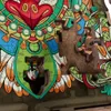A close-up view of a partially assembled jigsaw puzzle with a colorful, intricate design featuring a bird-like or mythological creature. Náhľad obrázku produktu