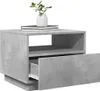 A concrete-effect bedside table with an open drawer and a vase with plants on top. Produktbild-Vorschau