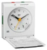 A white Braun alarm clock with its front cover open, revealing the clock face and a small information sheet underneath. Voir les images du produit