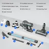 A collection of vacuum cleaner parts and accessories laid out on a light gray surface. Produktbild-Vorschau