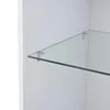 A close-up view of a glass shelf supported by metal brackets inside a white cabinet. Produktbild-Vorschau