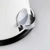A close-up shot of the pedal mechanism of a white trash can. Anteprima dell’immagine prodotto