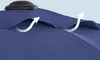 A close-up view of the top of a blue umbrella, showing ventilation flaps with arrows indicating airflow. Produktbild-Vorschau