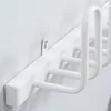 A close-up shot of a white wall-mounted shoe dryer. Produktbild-Vorschau