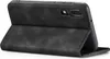 A black flip cover case for a smartphone is shown in an open position, displaying the inside of the case and the back of the phone. Produktbild-Vorschau