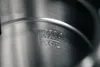 A close-up shot of the inside of a stainless steel kettle, showing embossed text indicating the maximum fill level. Voir les images du produit