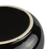 A close-up view of the rim and interior of a black ceramic pot. Náhľad obrázku produktu