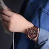 A person wearing a watch and holding a newspaper. Anteprima dell’immagine prodotto