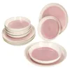A set of pink and white ceramic plates and bowls are arranged on a white background. Podgląd zdjęcia produktu