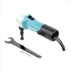 A teal and silver Makita nibbler tool with a black power cord and a black wrench and hex key are shown on a white background. Podgląd zdjęcia produktu