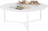 A white, round coffee table with decorative items on top, including magazines and natural elements. Produktbild-Vorschau