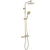 A gold-colored shower set with a thermostat, a rain shower head, and a handheld shower head, presented against a white background. Produktbild-Vorschau