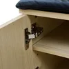 A close-up view of a cabinet hinge and shelf inside a wooden cabinet. Náhľad obrázku produktu