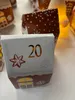 A close-up view of a Christmas advent calendar house with the number 20 visible. Produktbild-Vorschau