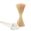A bundle of bamboo skewers, some with marshmallows on the end, against a white background. Produktbild-Vorschau