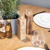 A table setting with salt and pepper grinders, drinks, and plates. Produktbild-Vorschau