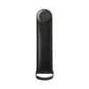 A black leather key organizer with a dark gray circular logo on top and a metal loop at the bottom, isolated on a white background. Produktbild-Vorschau