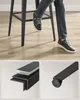 A person sitting on a bar stool with close-ups of the stool's construction and feet. Náhled obrázku produktu