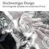 A close-up, folded view of a soft, plush blanket with a patterned design. Produktbild-Vorschau