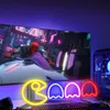 A gaming setup with a curved monitor displaying a futuristic racing game, a neon sign in the foreground, and a computer tower on the right. Voir les images du produit