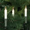 Three candle-shaped LED lights are attached to a Christmas tree. Produktbild-Vorschau