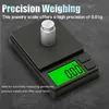 A close-up view of a digital jewelry scale with a calibration weight and a prominent display. Náhľad obrázku produktu