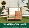 A wooden serving cart with shelves and a cabinet, placed on a green lawn in front of a white building. There are plants on either side. Produktbild-Vorschau