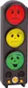 A traffic light-shaped device with smiley faces on red, yellow, and green lights. Voir les images du produit