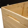 Close-up view of the side of a wooden chest with a carved handle. Anteprima dell’immagine prodotto