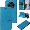 A collage of images showing a blue flip phone case with floral and butterfly designs. Produktbild-Vorschau