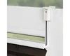 A close-up view of a white window frame with a brown pleated blind attached. Produktbild-Vorschau