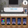 A modern white TV stand with LED lighting is shown, accompanied by mobile phone screenshots demonstrating app control of the lighting. Produktbild-Vorschau
